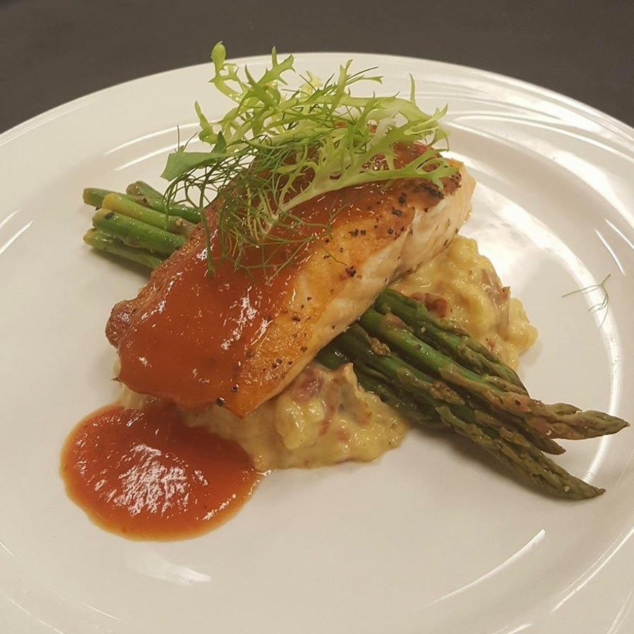 Salmon fillet with sauce, asparagus, and mash—ideal for Rochester Event Center summer weddings.